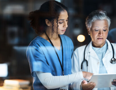 Women, doctors and tablet for night medical research, surgery planning and teamwork in hospital. Nurse, healthcare and worker collaboration on technology in late shift for wellness thinking and ideas