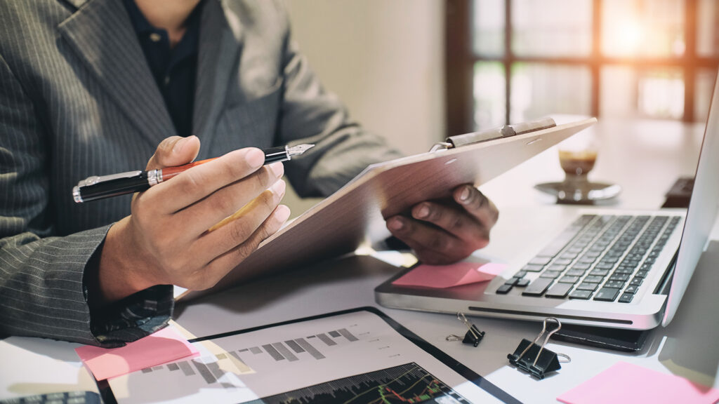Audit concept,Bookkeeper or financial inspector and secretary ma